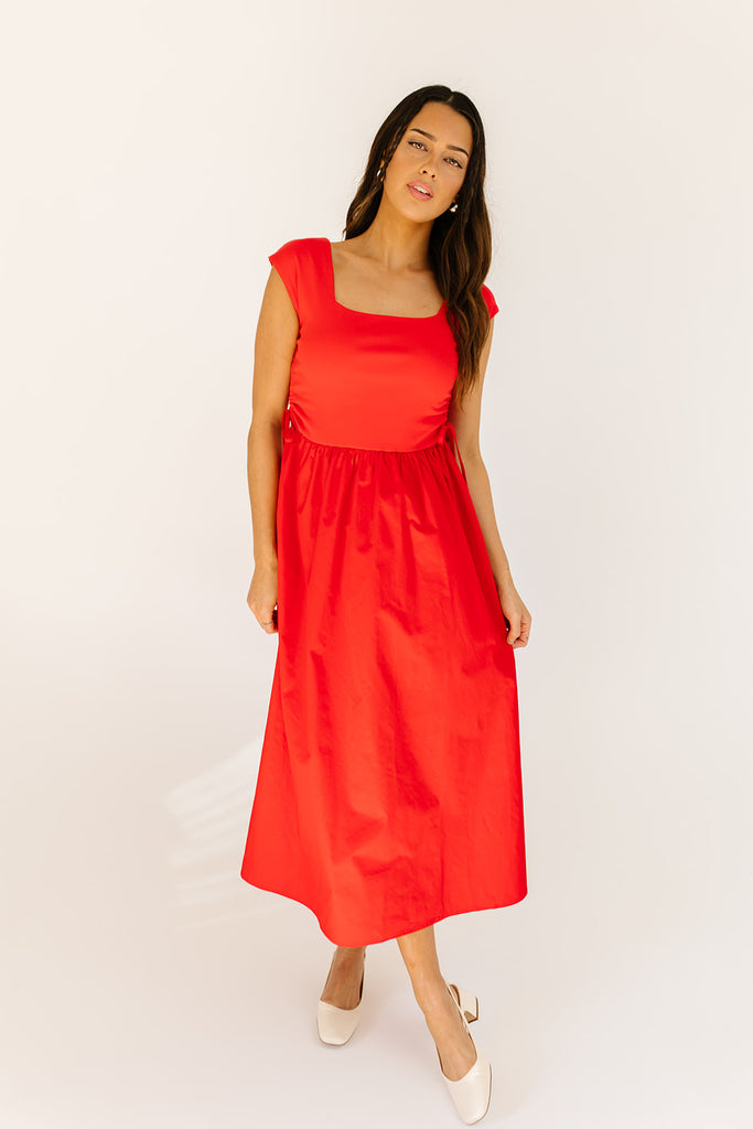 zoco afterglow dress: red short sleeve midi dress with a square neckline and side ties. perfect for date nights, weddings, and family pictures.
