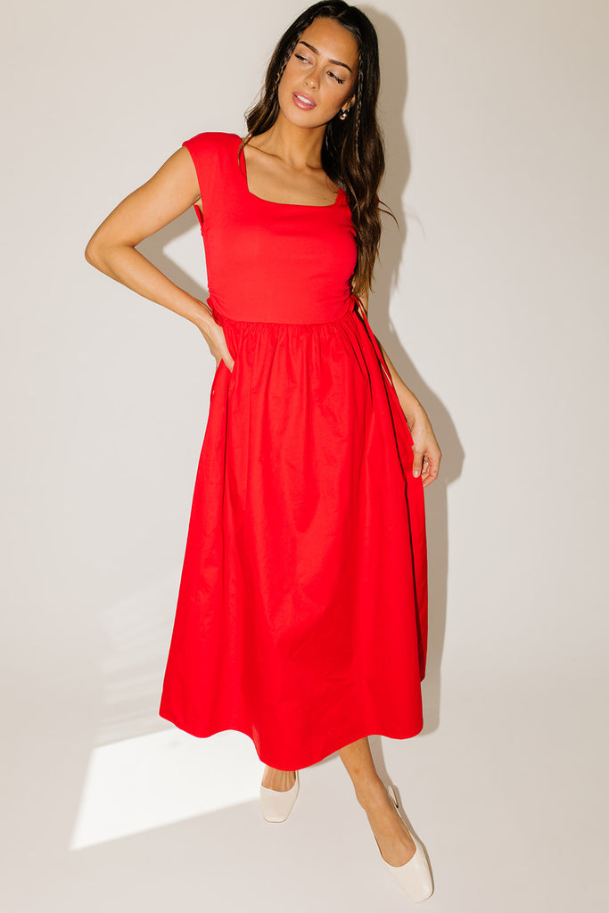 zoco afterglow dress: red short sleeve midi dress with a square neckline and side ties. perfect for date nights, weddings, and family pictures.