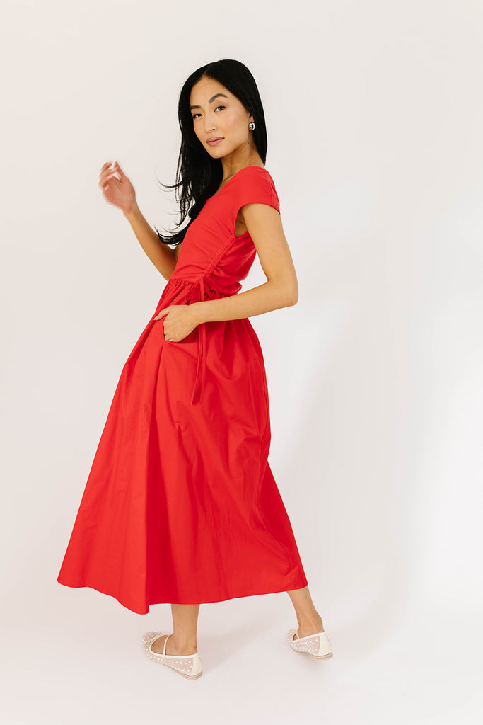 zoco afterglow dress: red short sleeve midi dress with a square neckline and side ties. perfect for date nights, weddings, and family pictures.