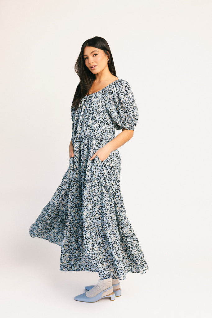 puff sleeve blue floral maxi dress with an elastic neckline. perfect for weddings, baby showers, and family pictures.