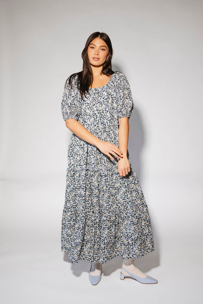 puff sleeve blue floral maxi dress with an elastic neckline. perfect for weddings, baby showers, and family pictures.