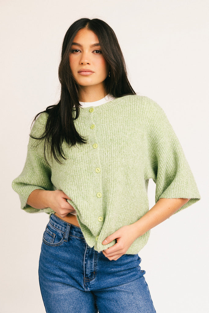 light green short sleeve cardigan with a slouchy, relaxed fit. perfect for casual outfits + lightweight layering.