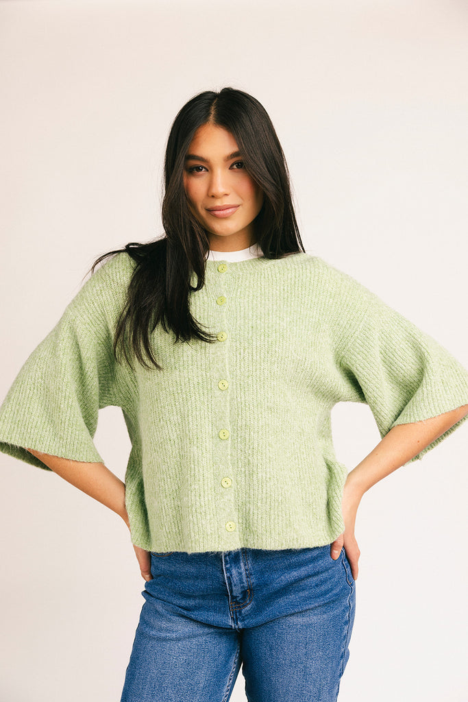 light green short sleeve cardigan with a slouchy, relaxed fit. perfect for casual outfits + lightweight layering.