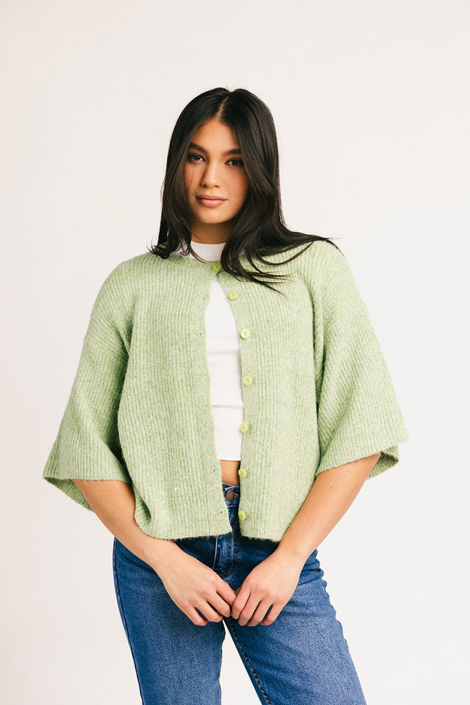light green short sleeve cardigan with a slouchy, relaxed fit. perfect for casual outfits + lightweight layering.