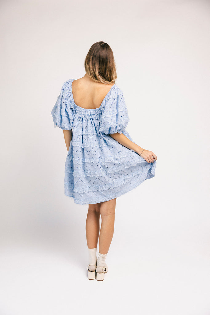 a blue puff sleeve mini dress with lace tiered details + a stretchy square neckline. perfect for family pictures, baby showers, weddings, + special occasions.