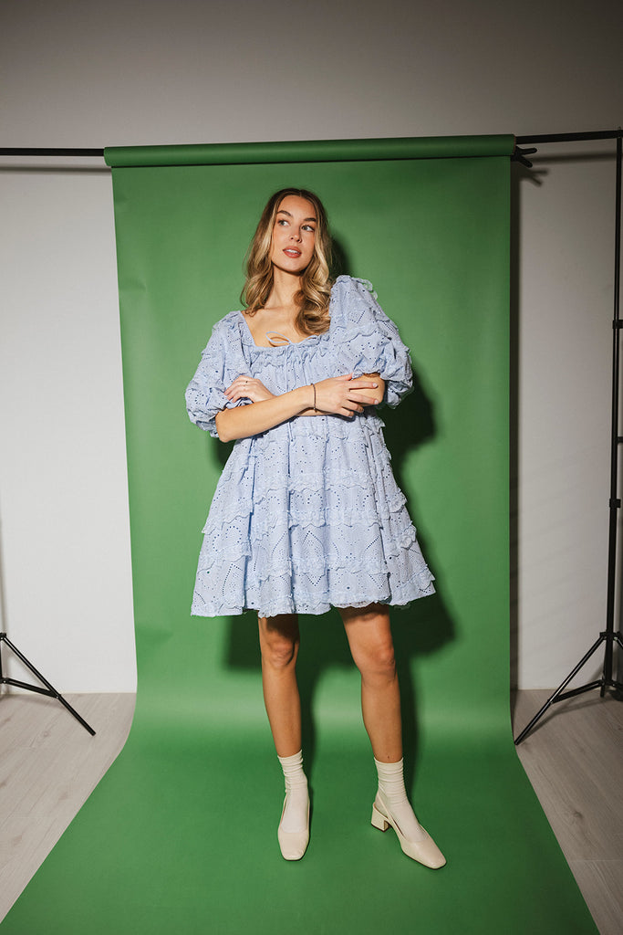 a blue puff sleeve mini dress with lace tiered details + a stretchy square neckline. perfect for family pictures, baby showers, weddings, + special occasions.