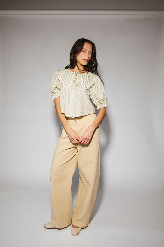 a vintage-inspired puff sleeve top with a pastel green pinstripe pattern + an oversized lace trim collar. the perfect elevated button up top for the office, dressy date nights, + everyday wear.