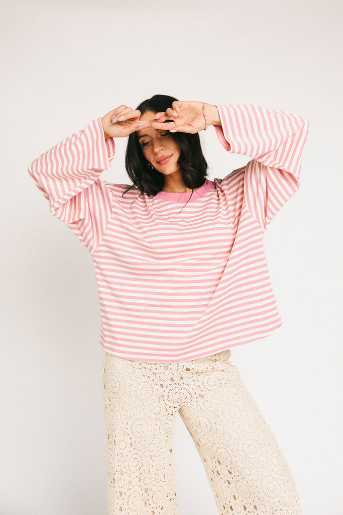 oversized pink striped long sleeve top. the perfect oversized striped t-shirt for concerts, airport outfits, + casual date nights.