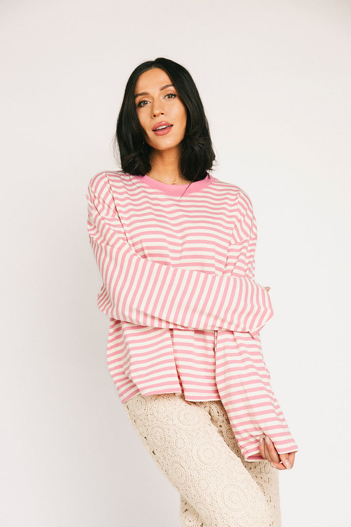 oversized pink striped long sleeve top. the perfect oversized striped t-shirt for concerts, airport outfits, + casual date nights.