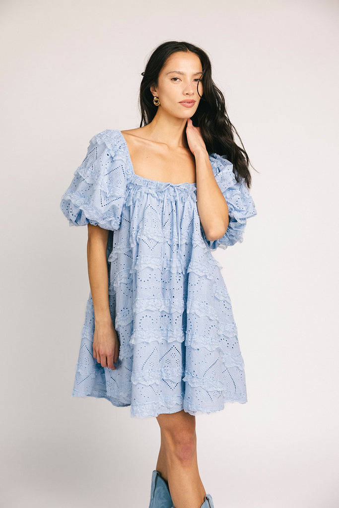 a blue puff sleeve mini dress with lace tiered details + a stretchy square neckline. perfect for family pictures, baby showers, weddings, + special occasions.