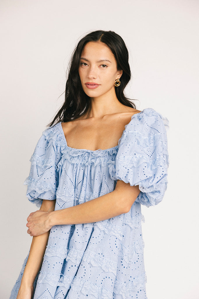 a blue puff sleeve mini dress with lace tiered details + a stretchy square neckline. perfect for family pictures, baby showers, weddings, + special occasions.