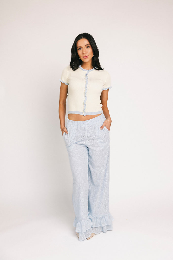 vintage-inspired short sleeve fitted top with blue ruffle details. the perfect elevated basic to dress up or down for any outfit idea.