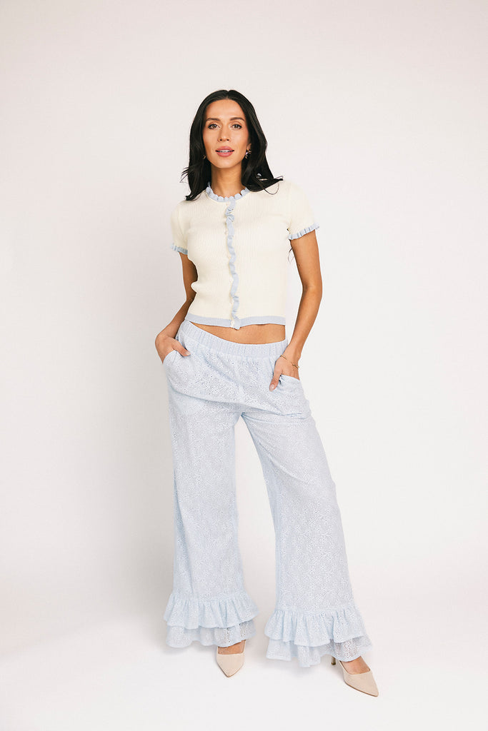 vintage-inspired short sleeve fitted top with blue ruffle details. the perfect elevated basic to dress up or down for any outfit idea.