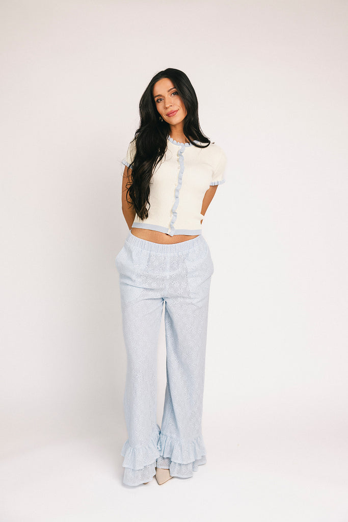 vintage-inspired short sleeve fitted top with blue ruffle details. the perfect elevated basic to dress up or down for any outfit idea.