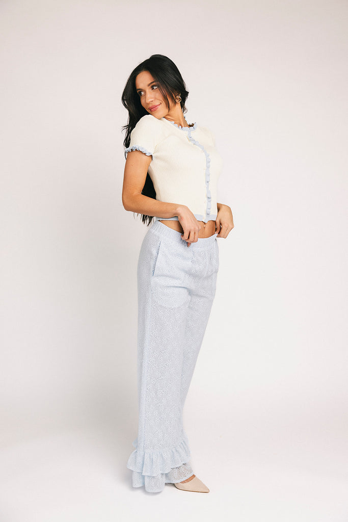 vintage-inspired short sleeve fitted top with blue ruffle details. the perfect elevated basic to dress up or down for any outfit idea.