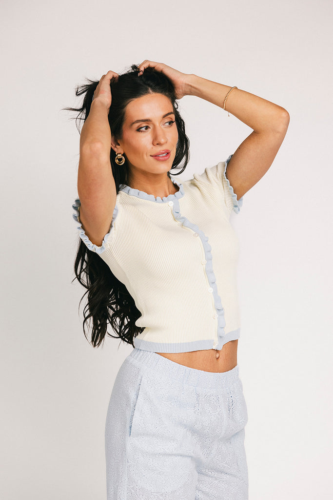 vintage-inspired short sleeve fitted top with blue ruffle details. the perfect elevated basic to dress up or down for any outfit idea.