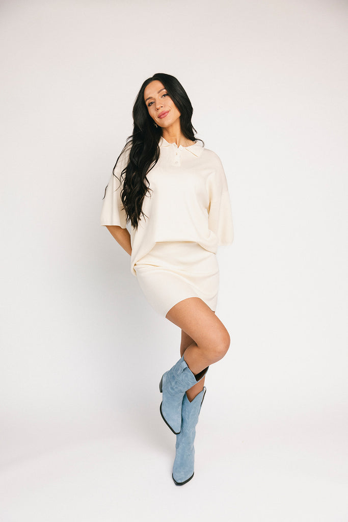 a casual skirt set with an oversized polo top + a fitted mini skirt. the perfect sporty two piece set to dress up or down for any outfit idea.