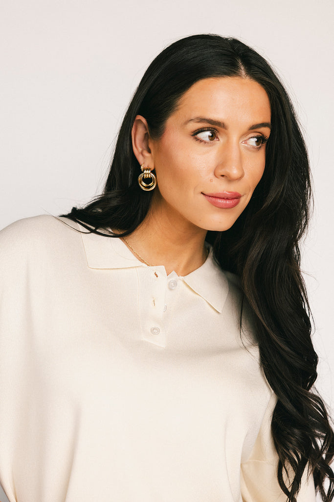 a casual skirt set with an oversized polo top + a fitted mini skirt. the perfect sporty two piece set to dress up or down for any outfit idea.