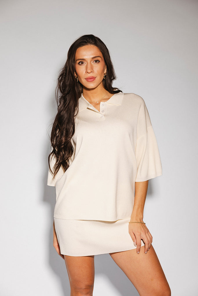 a casual skirt set with an oversized polo top + a fitted mini skirt. the perfect sporty two piece set to dress up or down for any outfit idea.
