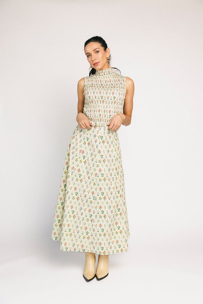 floral skirt set with a smocked mock neck tank + an a-line maxi skirt. the perfect elevated set for vacations, weddings, + fancy date nights.