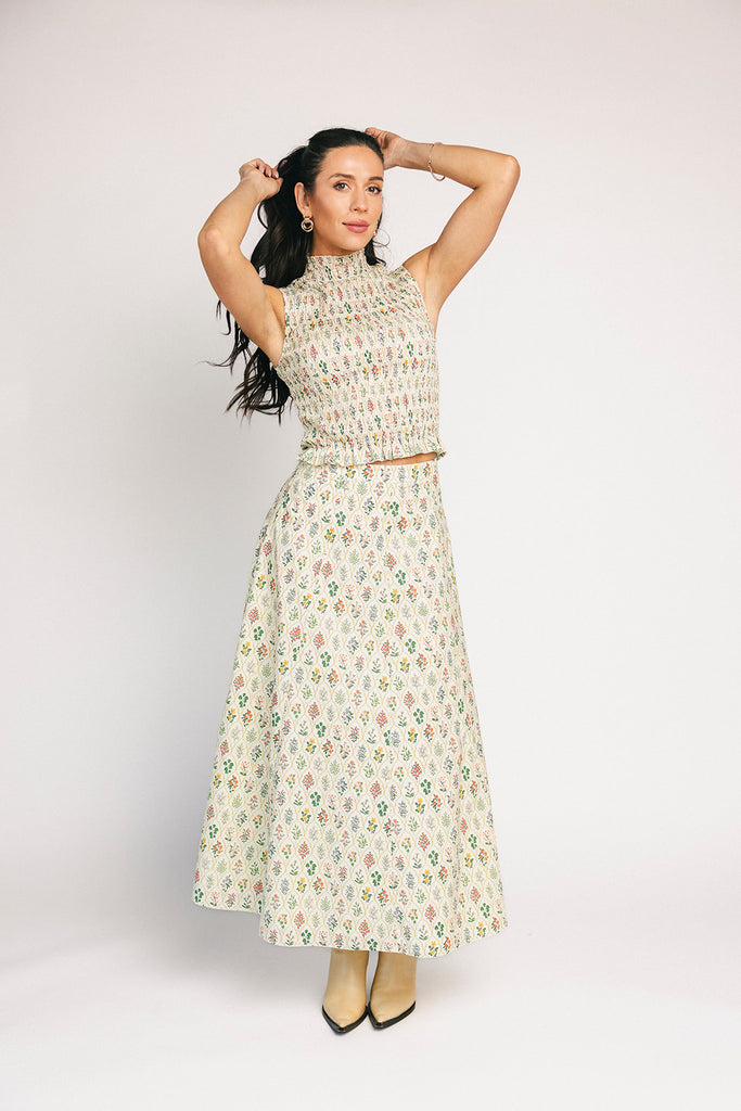 floral skirt set with a smocked mock neck tank + an a-line maxi skirt. the perfect elevated set for vacations, weddings, + fancy date nights.