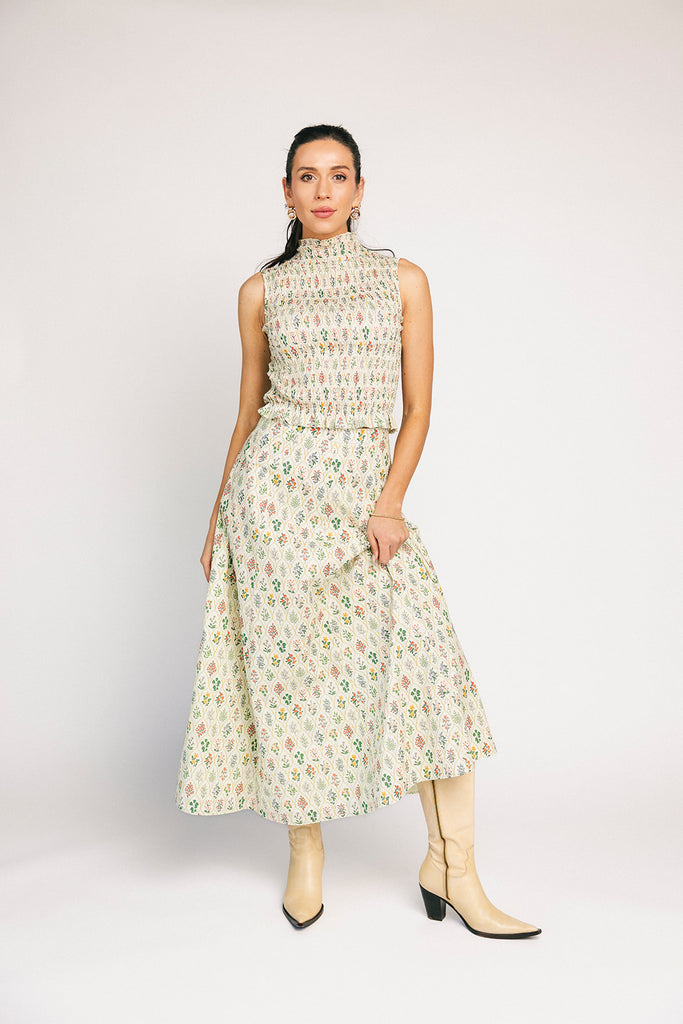 floral skirt set with a smocked mock neck tank + an a-line maxi skirt. the perfect elevated set for vacations, weddings, + fancy date nights.