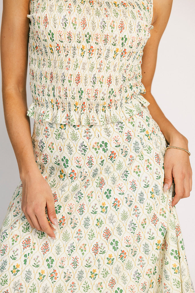 floral skirt set with a smocked mock neck tank + an a-line maxi skirt. the perfect elevated set for vacations, weddings, + fancy date nights.