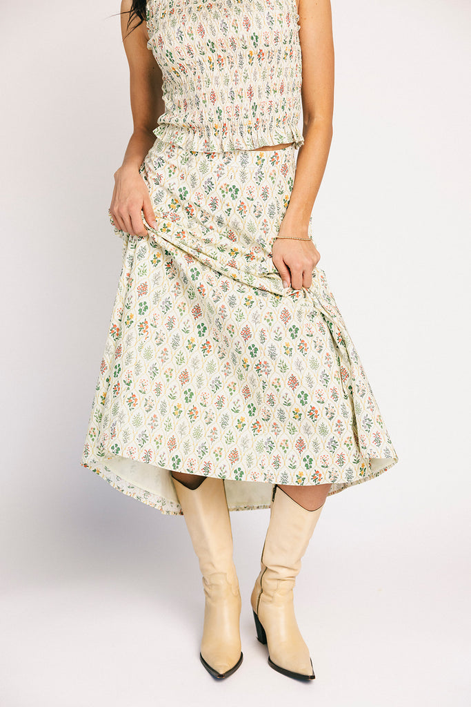 floral skirt set with a smocked mock neck tank + an a-line maxi skirt. the perfect elevated set for vacations, weddings, + fancy date nights.