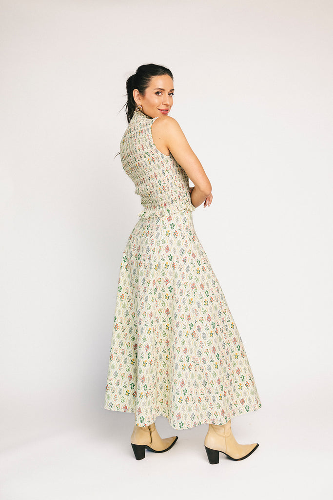 floral skirt set with a smocked mock neck tank + an a-line maxi skirt. the perfect elevated set for vacations, weddings, + fancy date nights.