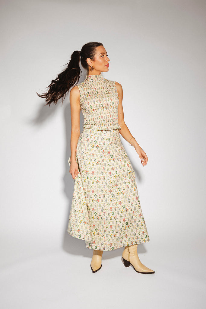 floral skirt set with a smocked mock neck tank + an a-line maxi skirt. the perfect elevated set for vacations, weddings, + fancy date nights.