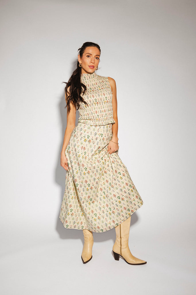 floral skirt set with a smocked mock neck tank + an a-line maxi skirt. the perfect elevated set for vacations, weddings, + fancy date nights.