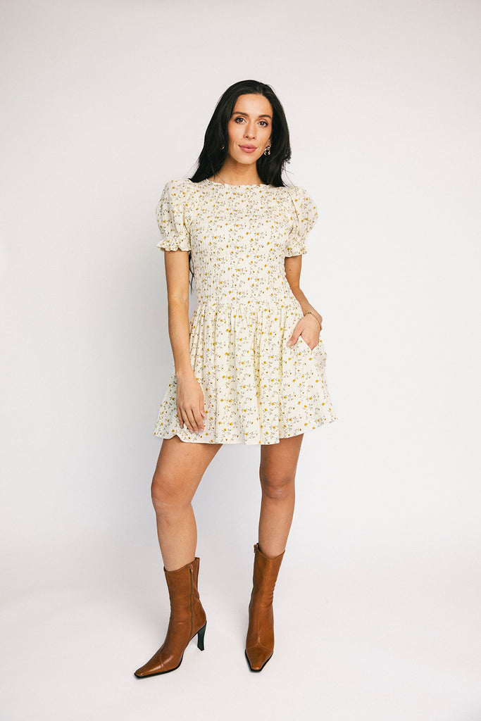 a floral puff sleeve dress with a smocked bodice + mini length. the perfect ditsy floral dress for family pictures, bridal showers, + brunch dates.
