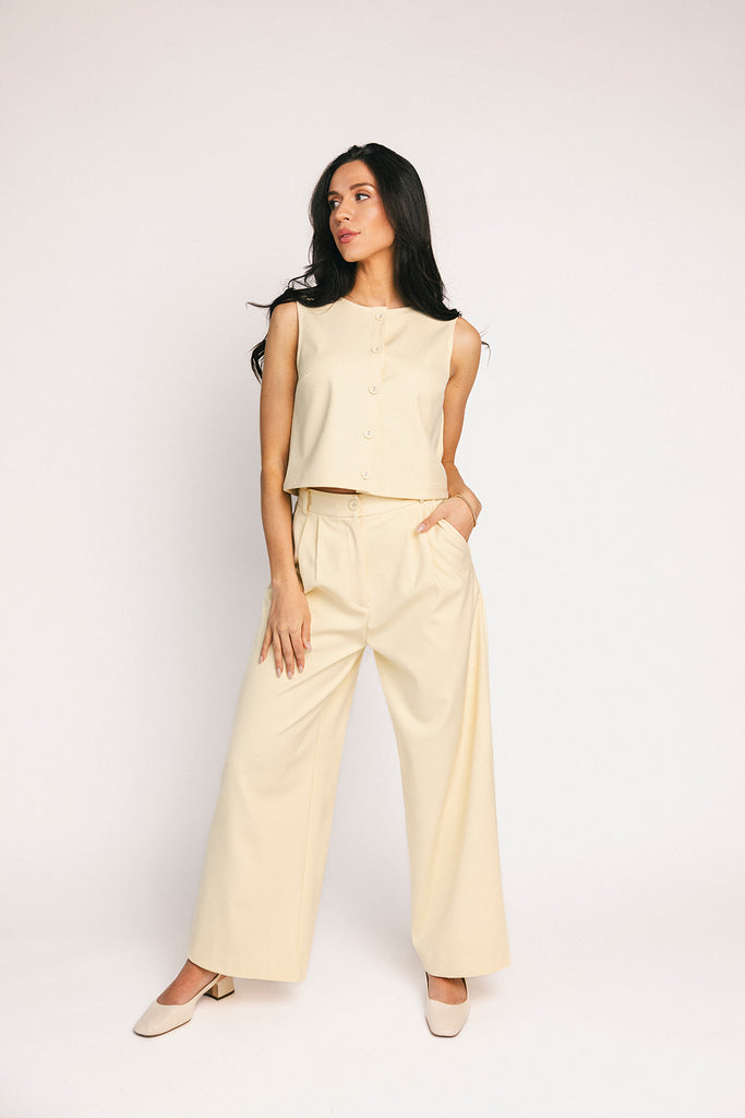 butter yellow pant set with a cropped button up tank + high waisted trousers. the perfect elevated set for the office + everyday wear.