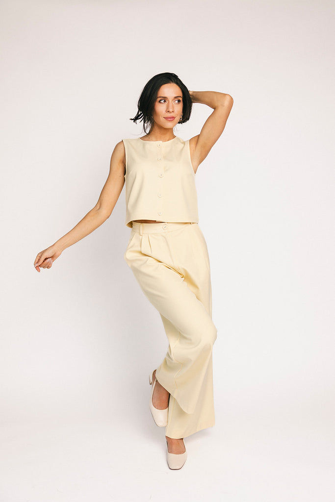 butter yellow pant set with a cropped button up tank + high waisted trousers. the perfect elevated set for the office + everyday wear.