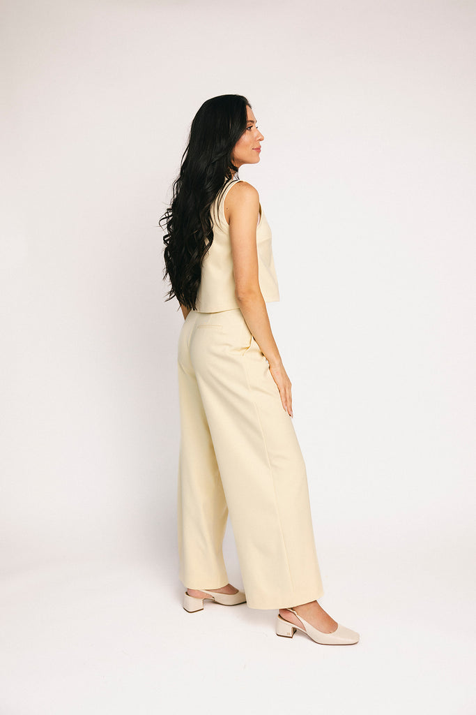 butter yellow pant set with a cropped button up tank + high waisted trousers. the perfect elevated set for the office + everyday wear.