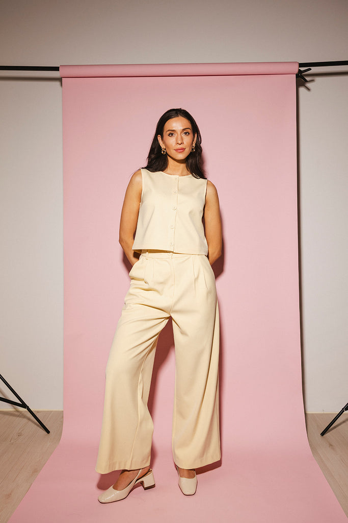 butter yellow pant set with a cropped button up tank + high waisted trousers. the perfect elevated set for the office + everyday wear.