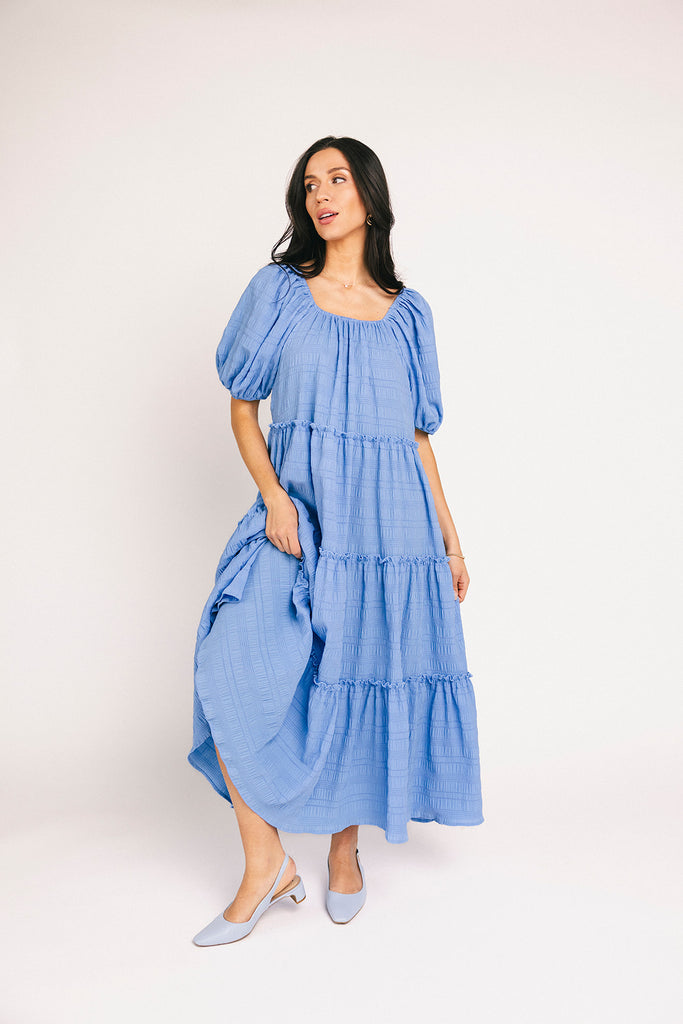 zoco daymaker dress: puff sleeve blue maxi dress with an elastic neckline. perfect for weddings, baby showers, and family pictures.