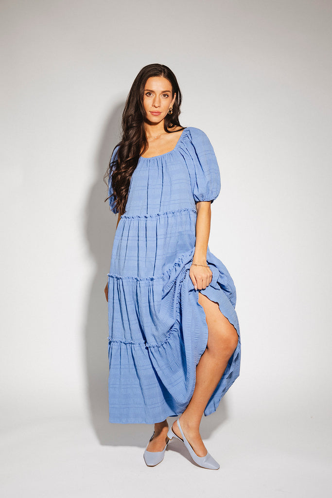 zoco daymaker dress: puff sleeve blue maxi dress with an elastic neckline. perfect for weddings, baby showers, and family pictures.
