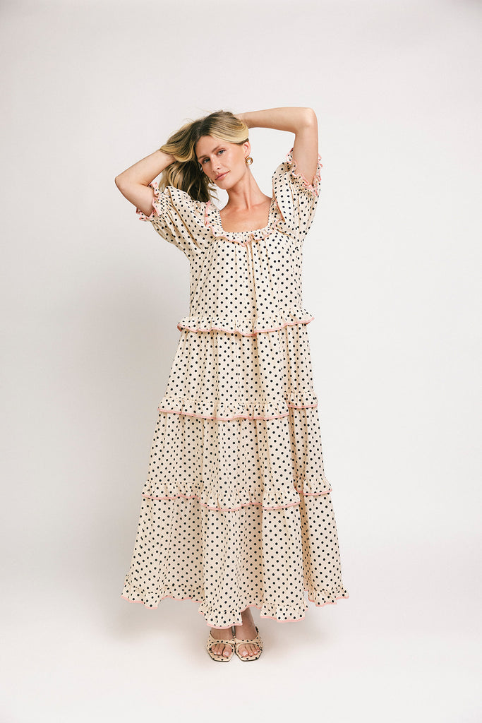 zoco daymaker dress: puff sleeve polka dot dress with an elastic neckline and pink trim details. perfect for weddings, baby showers, and family pictures.