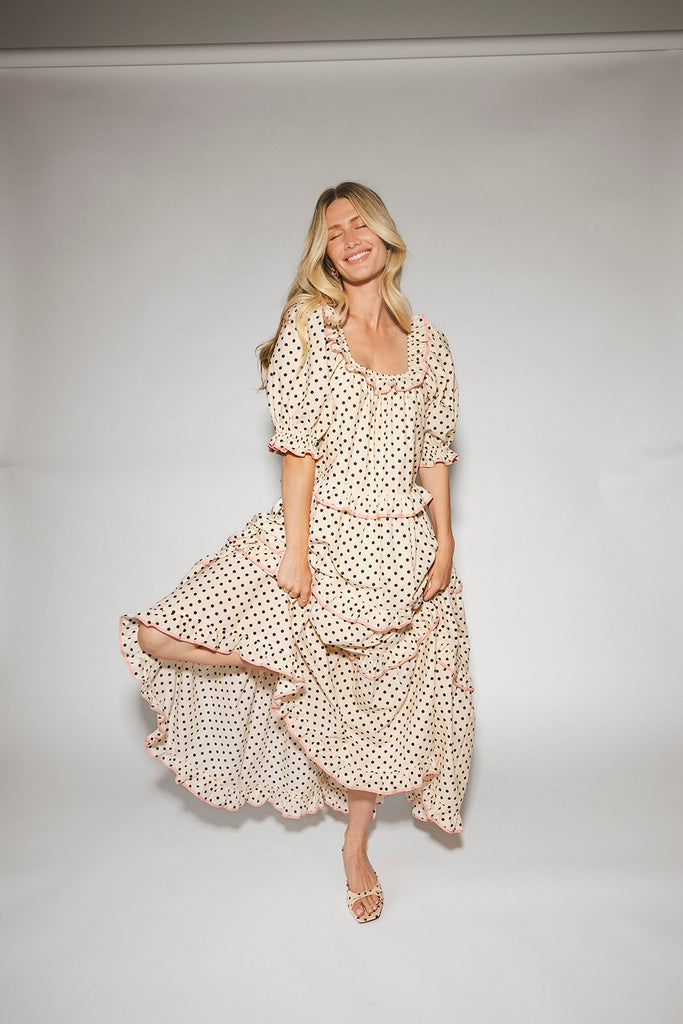 zoco daymaker dress: puff sleeve polka dot dress with an elastic neckline and pink trim details. perfect for weddings, baby showers, and family pictures.