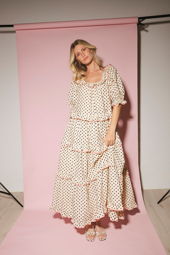 zoco daymaker dress: puff sleeve polka dot dress with an elastic neckline and pink trim details. perfect for weddings, baby showers, and family pictures.