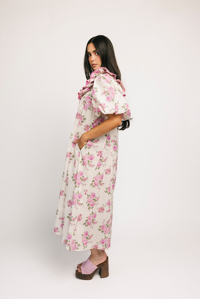a pink floral puff sleeve dress with a ruffle neckline. the perfect vintage-inspired dress for baby showers, family pictures, + special occasions.
