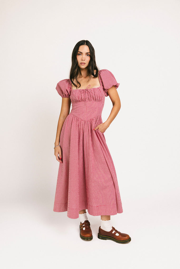 vintage-inspired puff sleeve dress with a square neckline. the perfect red gingham puff sleeve dress for rodeos, family pictures,+ semi-casual occasions.