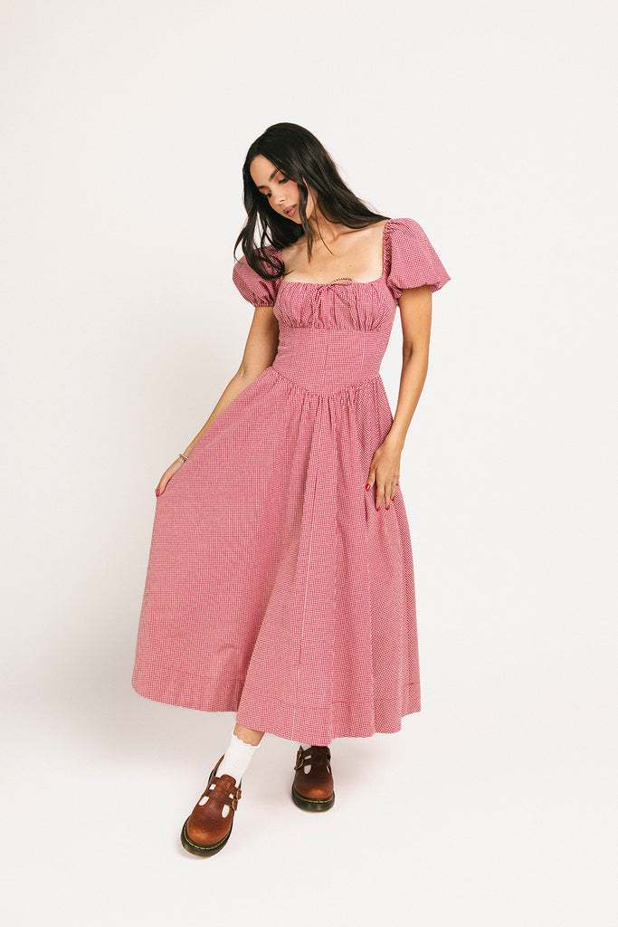 vintage-inspired puff sleeve dress with a square neckline. the perfect red gingham puff sleeve dress for rodeos, family pictures,+ semi-casual occasions.