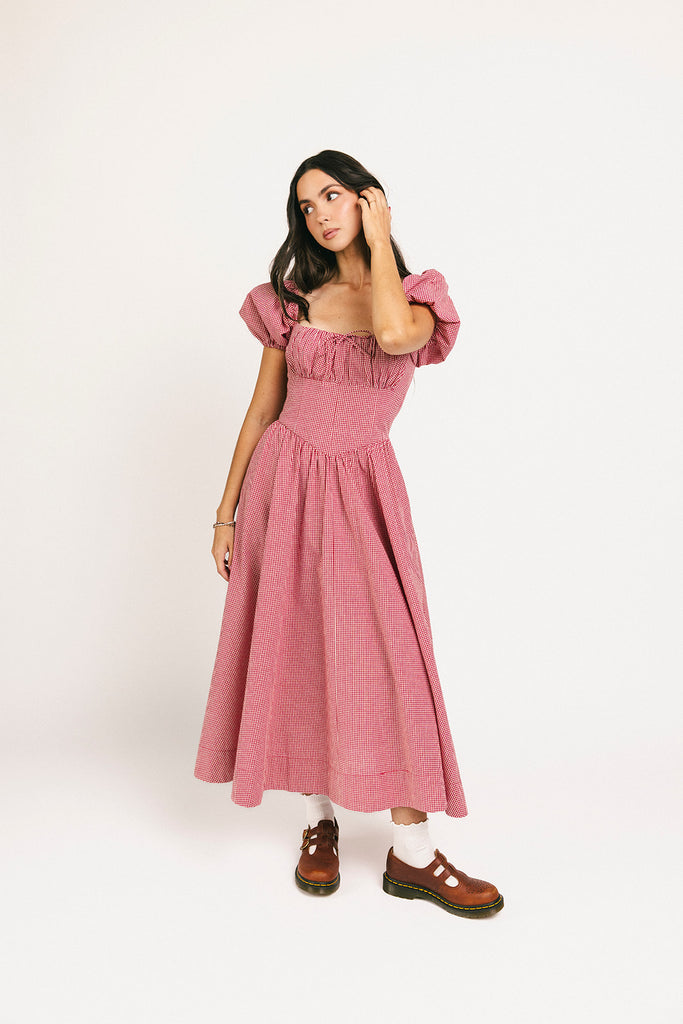 vintage-inspired puff sleeve dress with a square neckline. the perfect red gingham puff sleeve dress for rodeos, family pictures,+ semi-casual occasions.