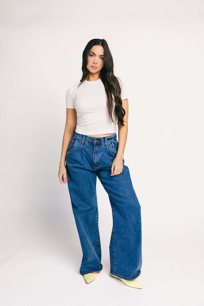 a classic plain white baby tee with a slightly cropped silhouette. the perfect fitted white t-shirt for everyday wear + casual outfit styling.