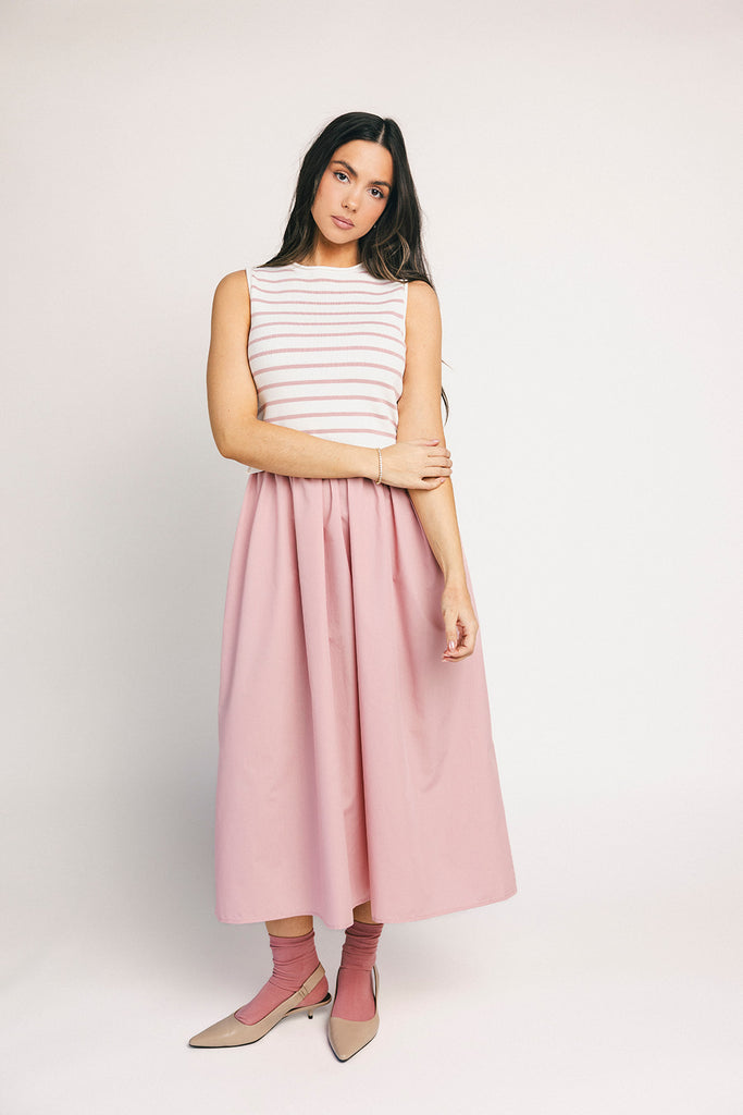 a-line pink midi dress with a striped knit vest detail. the perfect casual dress for baby showers, brunch dates, + family pictures.