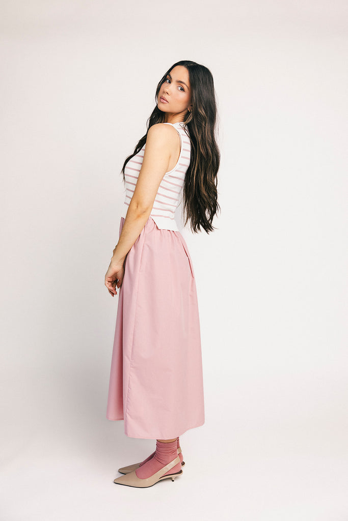 a-line pink midi dress with a striped knit vest detail. the perfect casual dress for baby showers, brunch dates, + family pictures.