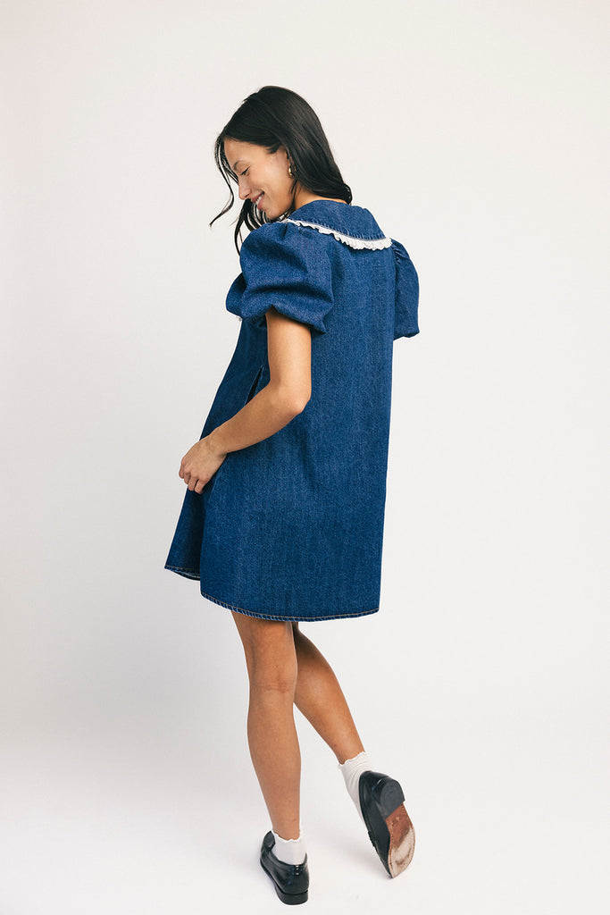 a puff sleeve denim dress with a lace trimmed collar detail. the perfect denim mini dress for date nights, family pictures, + everyday wear.