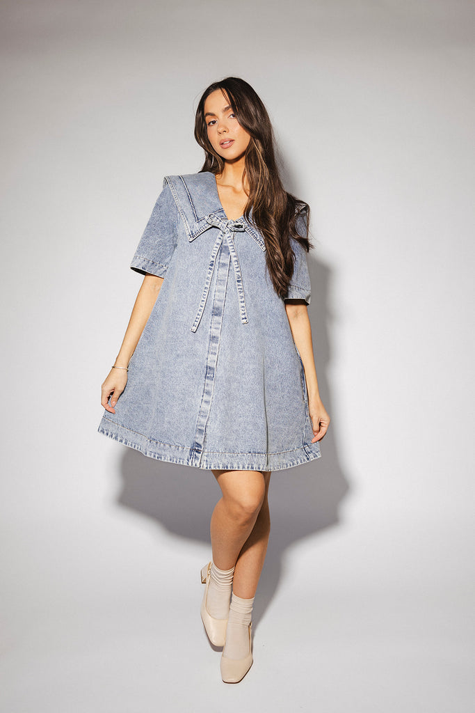 vintage-inspired short sleeve denim dress with an oversized collar + bow detail. the perfect denim mini dress for date nights, family pictures, + everyday wear.